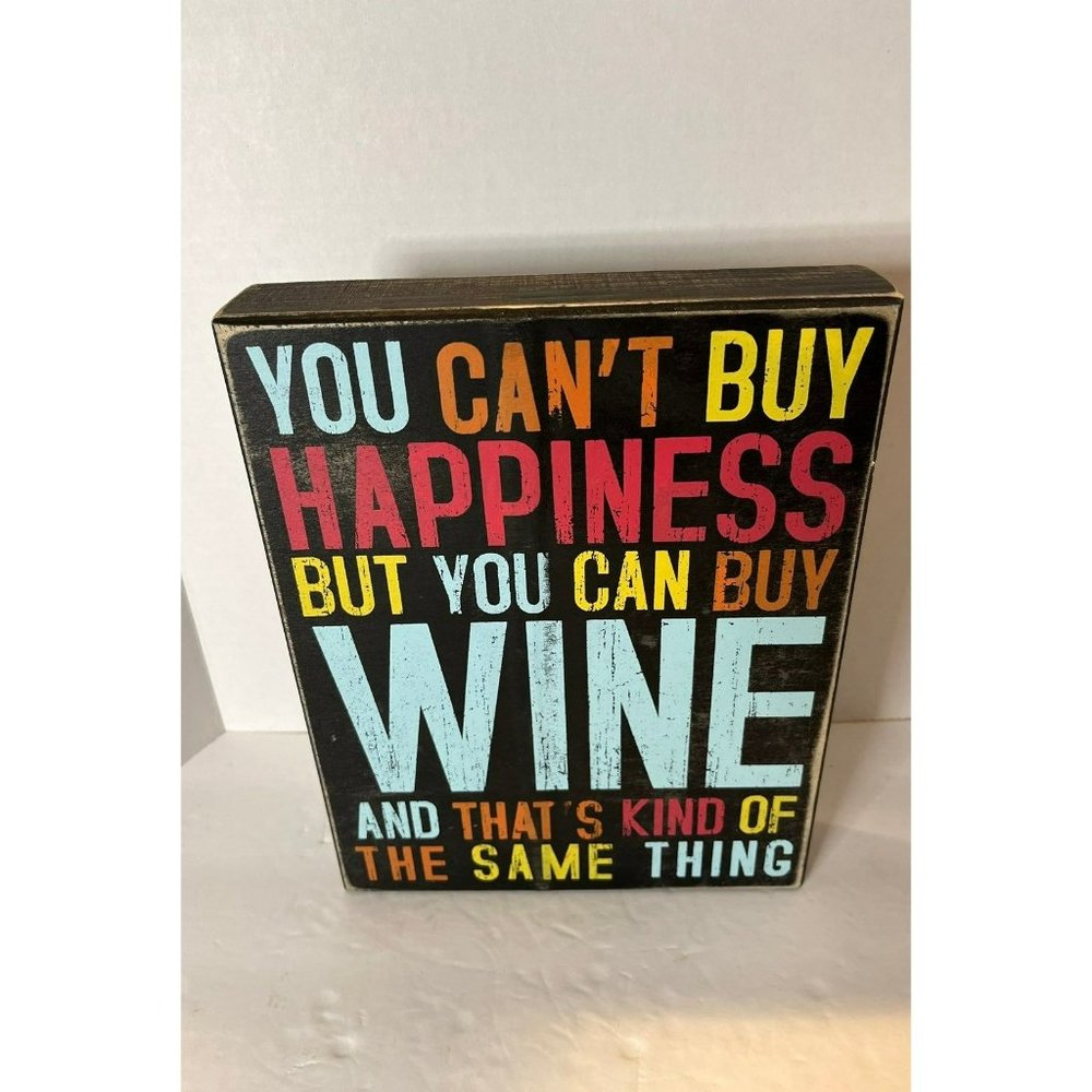 Wood block sign "You Can't Buy Happiness But You Can Buy Wine And That's Kind Of